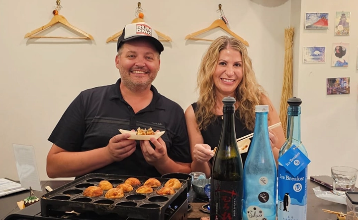 Guests enjoying sake and Osaka cuisine experience