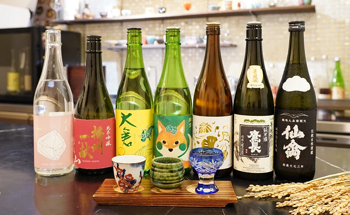 Various Japanese sake bottles prepared for tasting