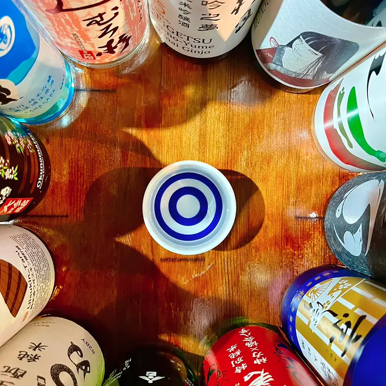 Japanese sake bottles and tasting cup